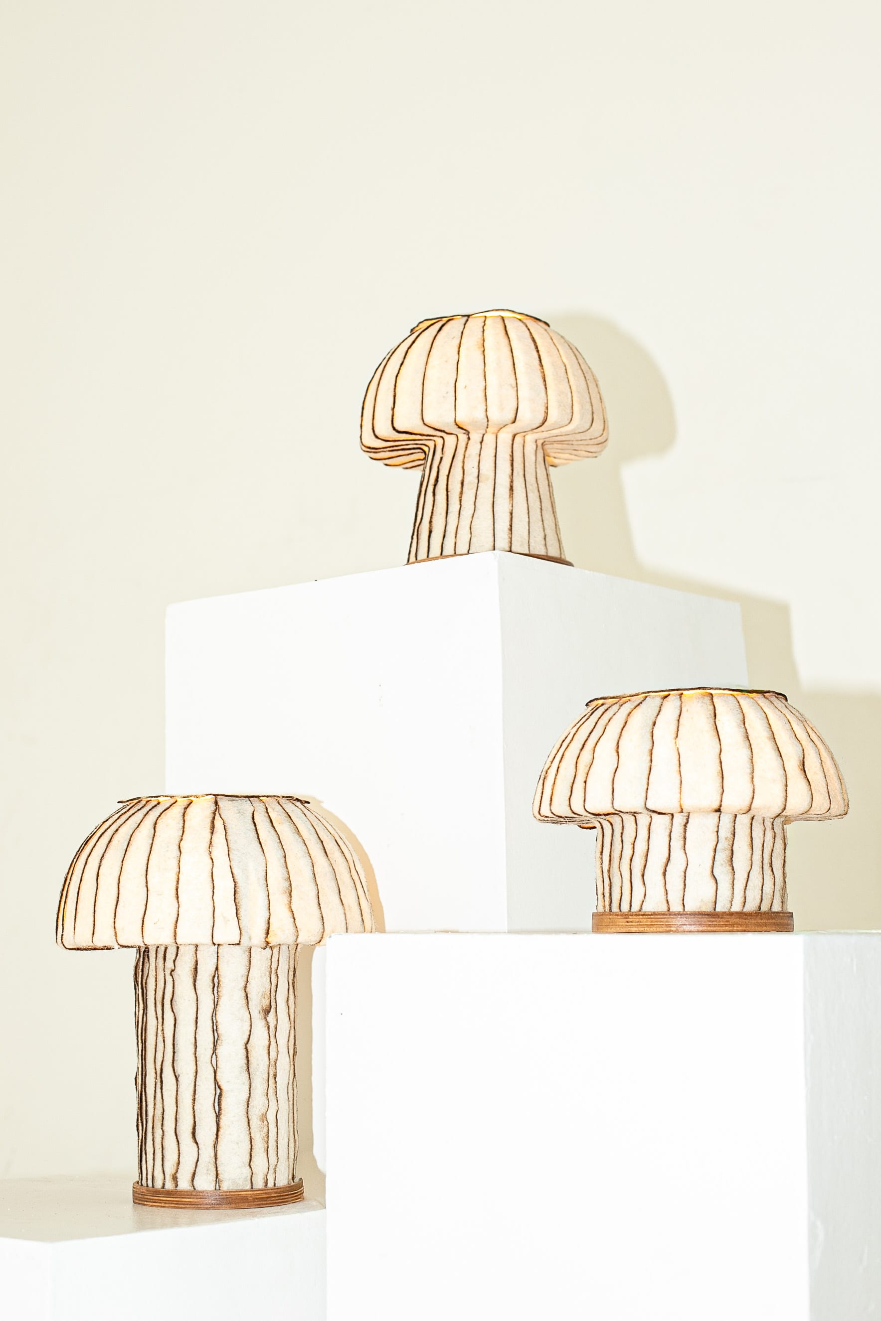 Industrial designer Jasser Aguila designed the "Kabu Lamps" using hand-layered strips of Hiblafelt. He burned the edges to create that added layer of texture and contrast.